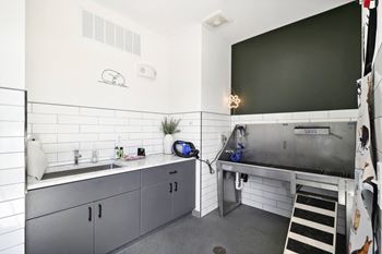A kitchen with stainless steel counters and a sink